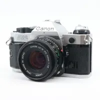 Canon AE-1 Program zilver + FD 50mm f/1.8 occasion - tweedehands (occasion) — outlet/retourdeal